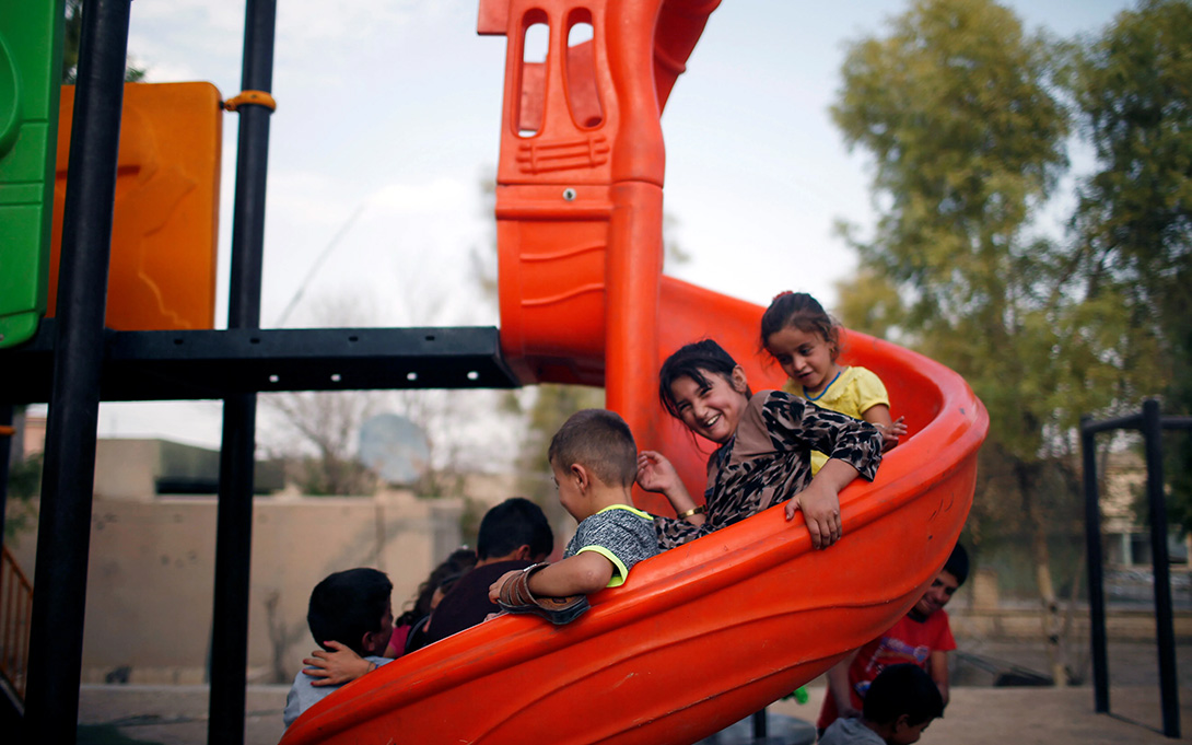 Thumbnail to 2018 Brookings Journal Article: school aged children playing on the slides