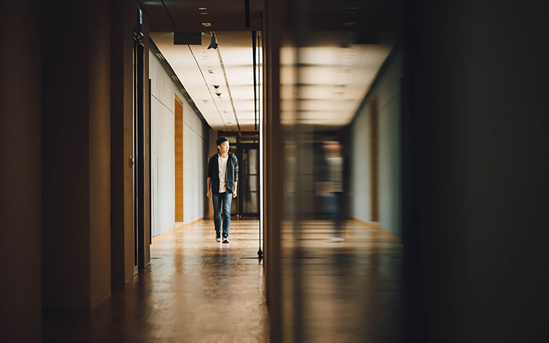 a student walking down a school hallway