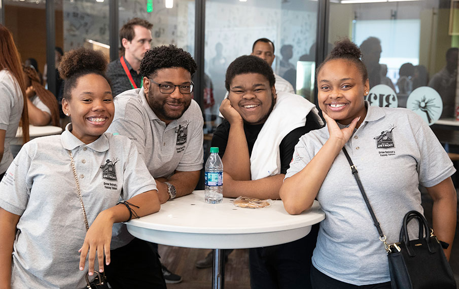 fout detroit high school students smiling to the camera