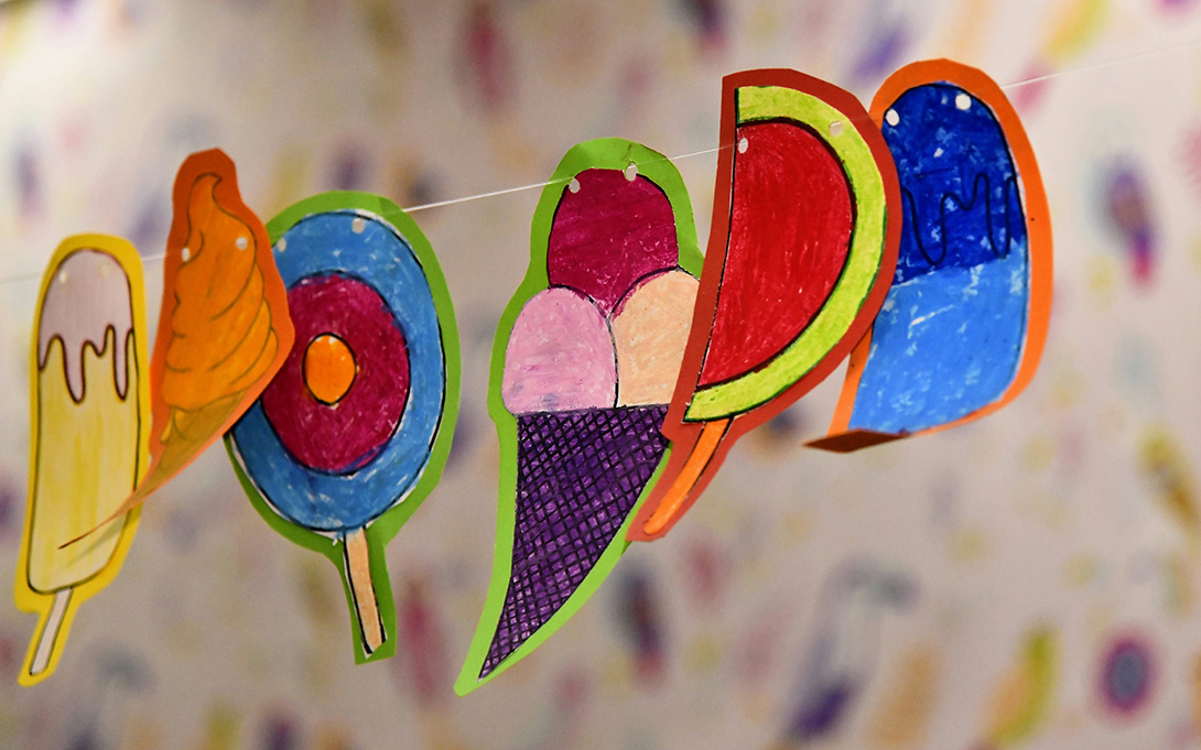 a row of ice cream drawings on a string