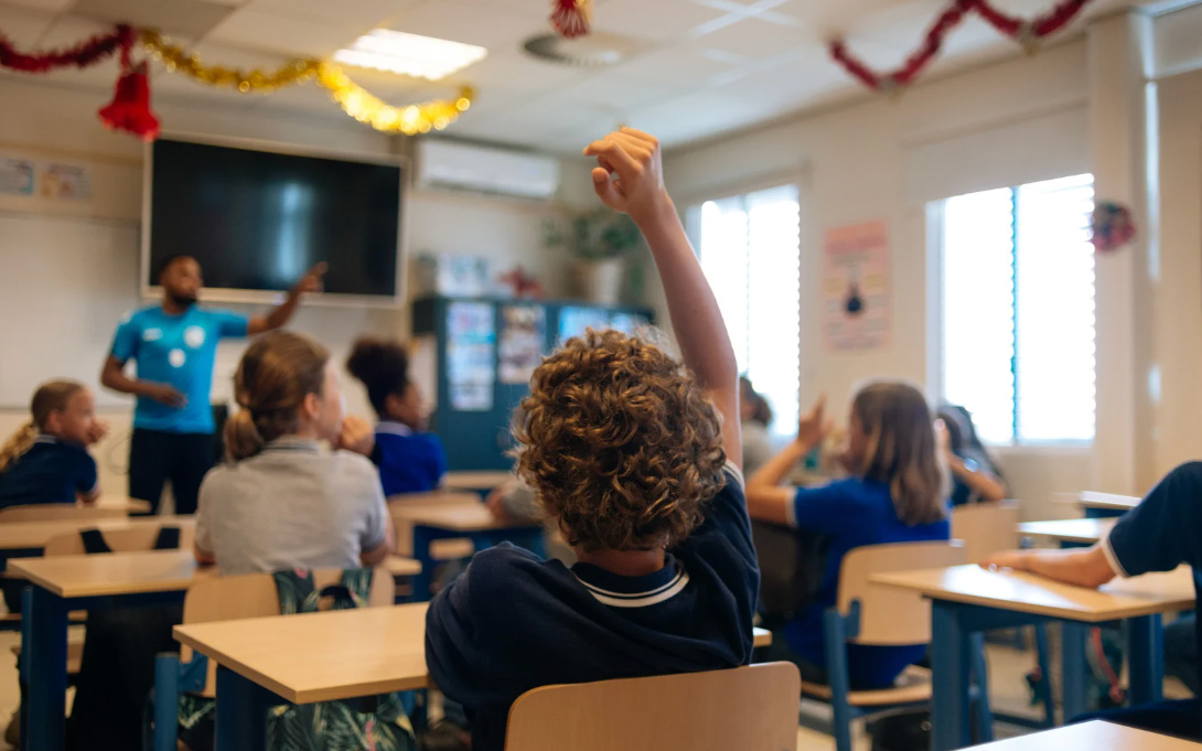 a classroom with a teacher and students