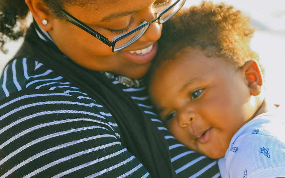 Thumbnail photo for the MIHP age expansion project report: A young mother holding an infant
