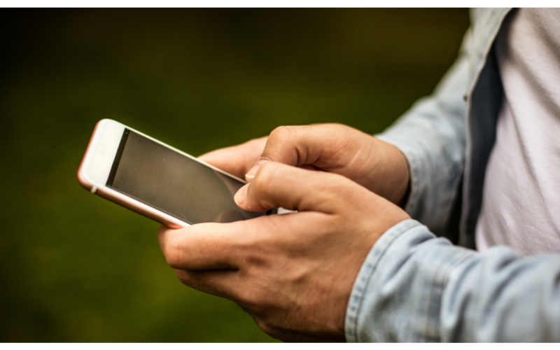 person texting on phone